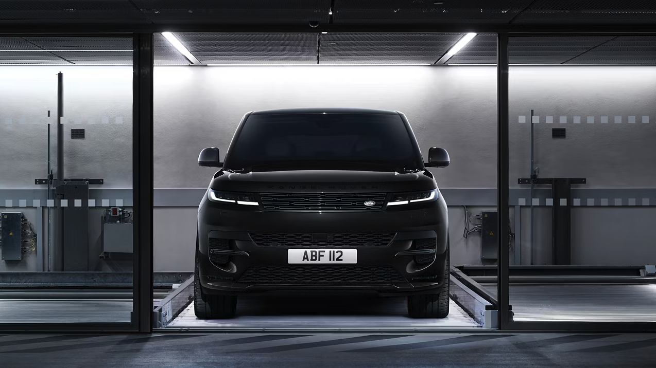 Front view of the 2025 Range Rover Sport in a dimly-lit setting Front view of the 2025 Range Rover Sport in a dimly-lit setting