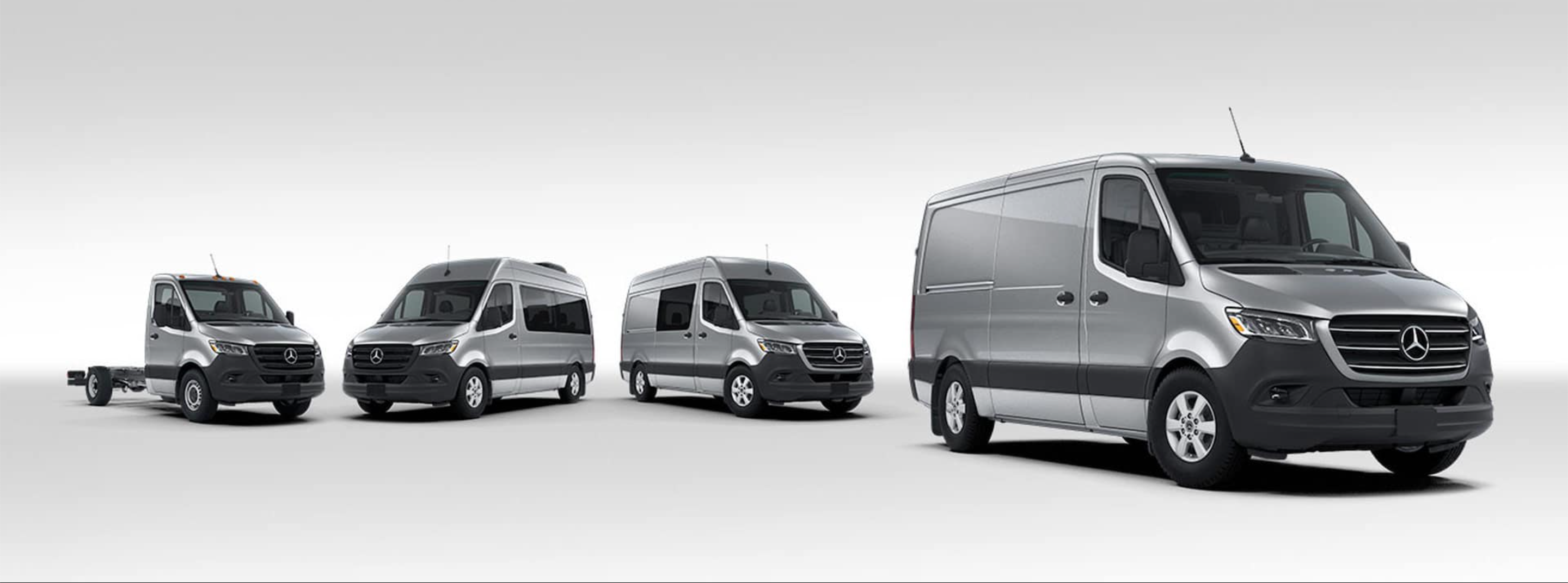 Four Mercedes-Benz Sprinter models lined up in a row with a grey background