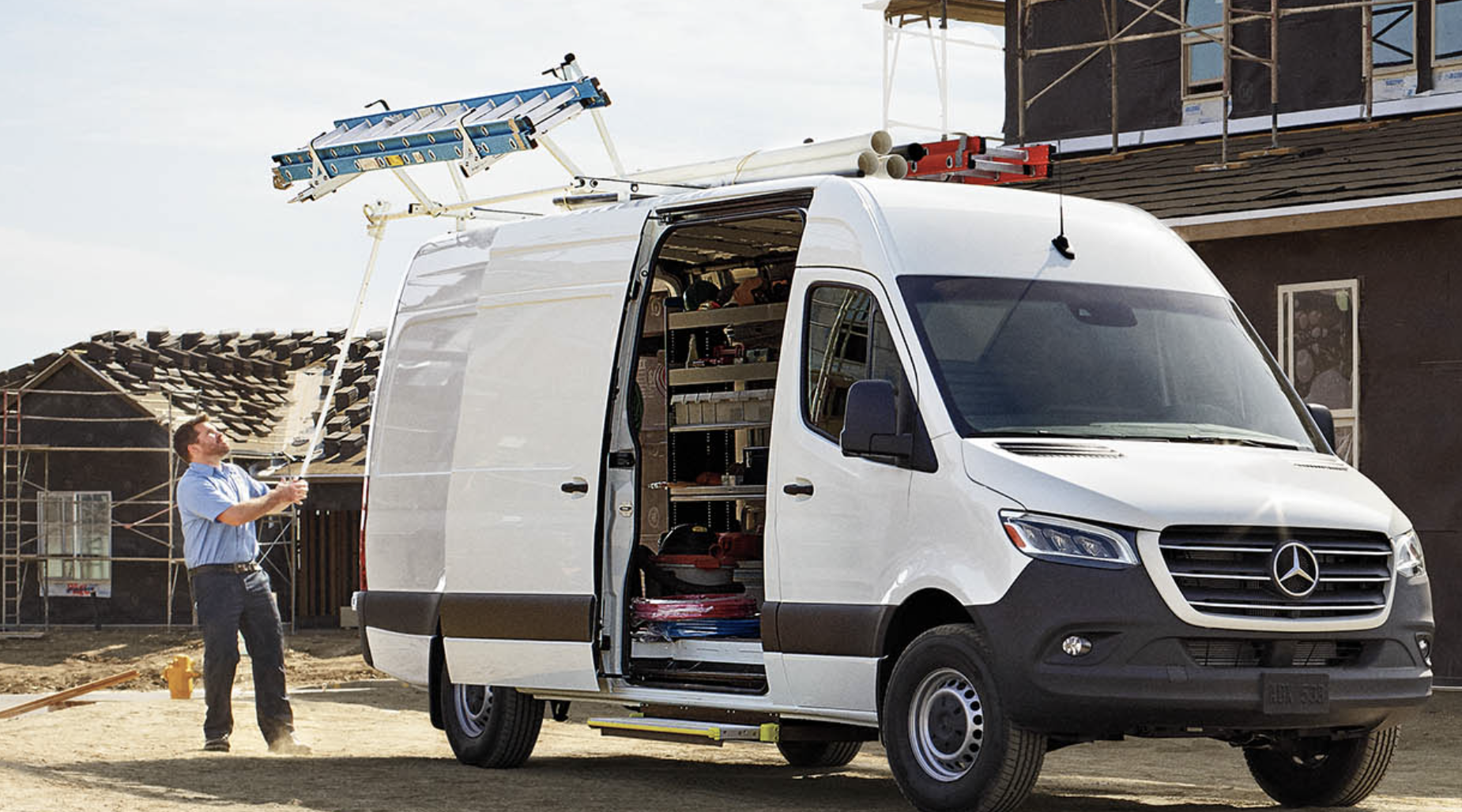 2024 Range Rover Sport driving through mud and water