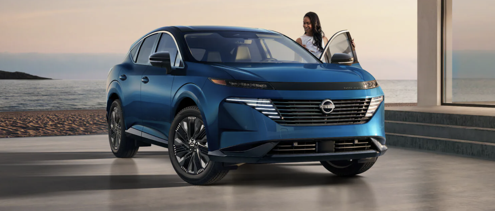 woman getting into a 2027 Nissan Murano