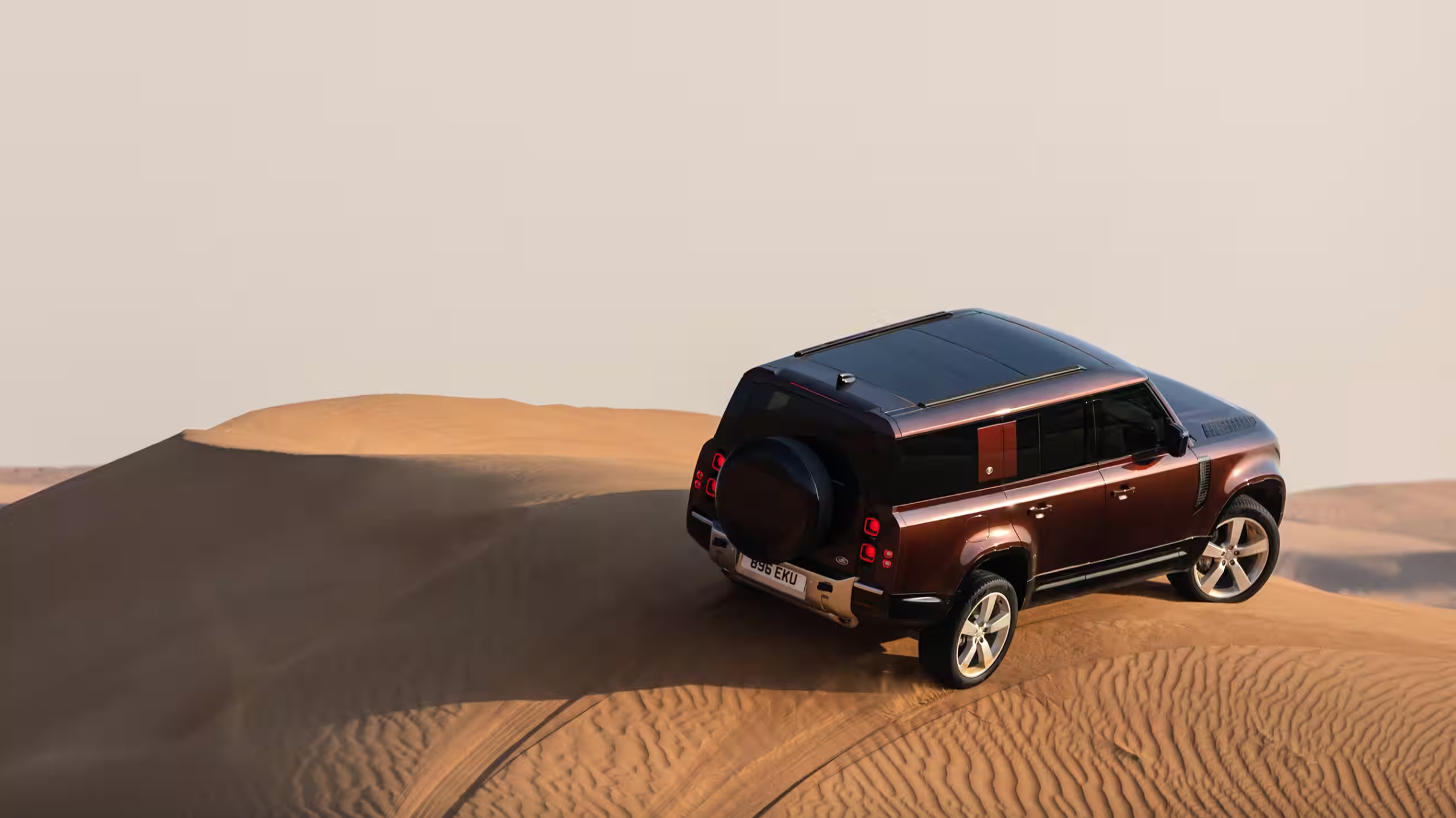 2024 Defender 130 driving on sand dunes