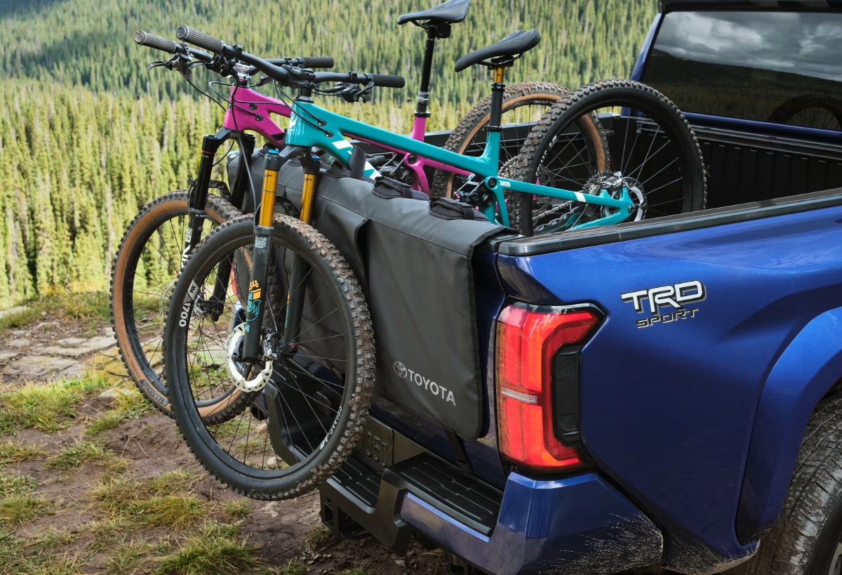 Close up of the bed of a 2024 Toyota Tacoma with two bikes over the tailgate