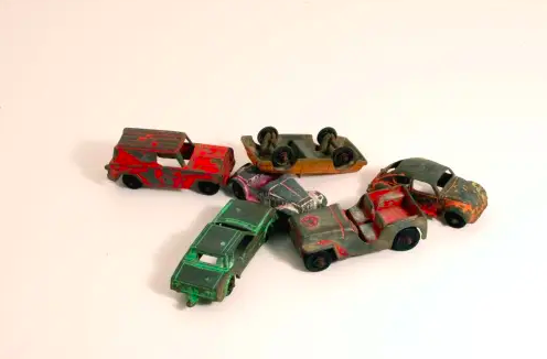 common car accidents represented by toy car collisions