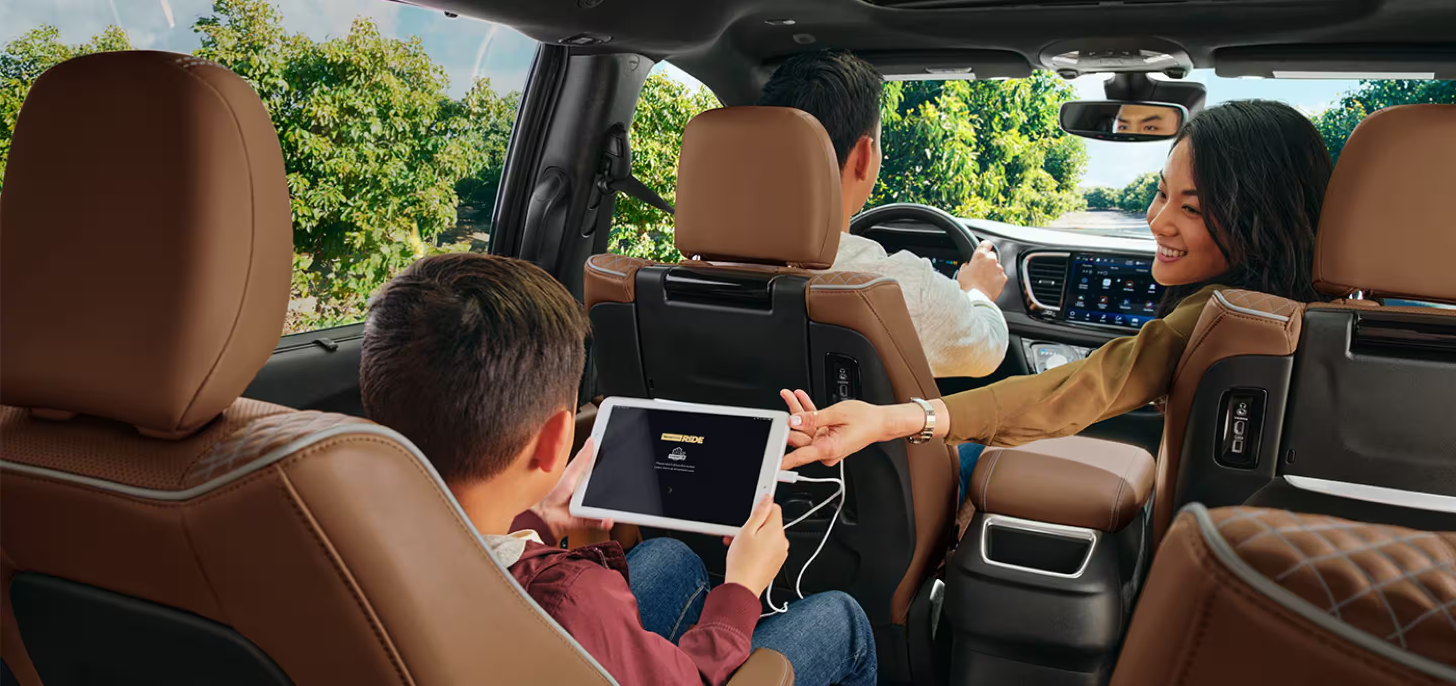Family inside of a new Chrysler Pacifica
