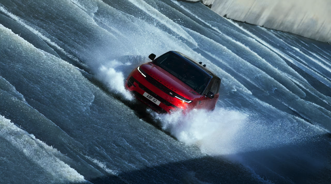 Range Rover Sport driving through water in Iceland's Kárahnjúkar Dam spillway