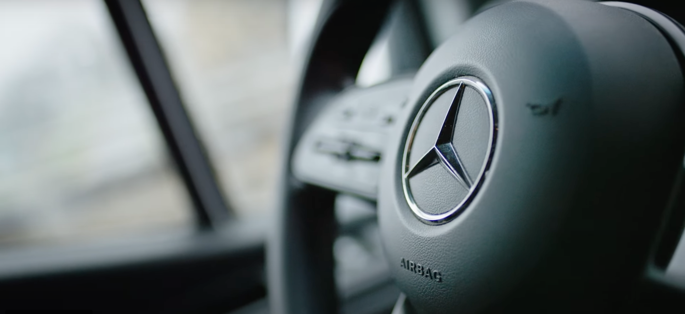Close-up view of a Mercedes-Benz Sprinter Van steering wheel