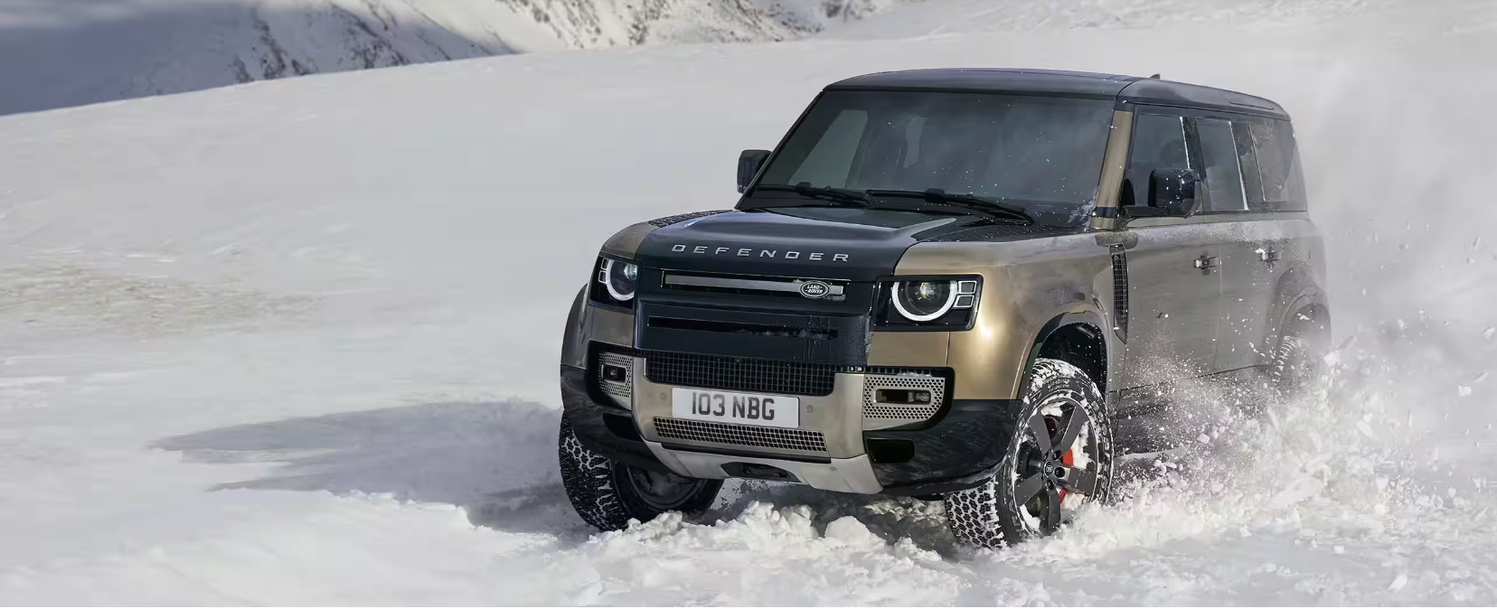 Defender 110 driving through snow